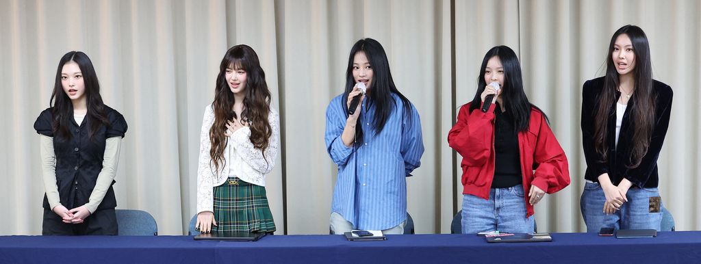 South Korean K-pop girl group NewJeans members (L-R) Haerin, Danielle, Minji, Hanni and Hyein attend a press conference in Seoul on November 28, 2024. Chart-topping K-pop group NewJeans quit their label ADOR, citing the group faced 