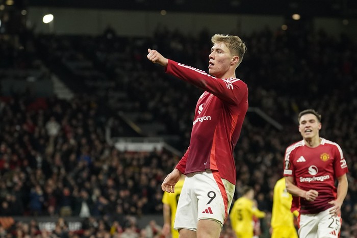Manchester Uniteds Rasmus Hojlund celebrates after scoring his sides second goal during the Europa League opening phase soccer match between Manchester United and Bodo Glimt, at the Old Trafford stadium in Manchester, England, Thursday, Nov. 28, 2024. (AP Photo/Dave Thompson)
