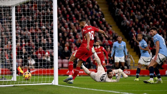 LIVERPOOL, ENGLAND - DECEMBER 01: (THE SUN OUT, THE SUN ON SUNDAY OUT) Cody Gakpo of Liverpool scoring the opening goal during the Premier League match between Liverpool FC and Manchester City FC at Anfield on December 01, 2024 in Liverpool, England. (Photo by Andrew Powell/Liverpool FC via Getty Images)