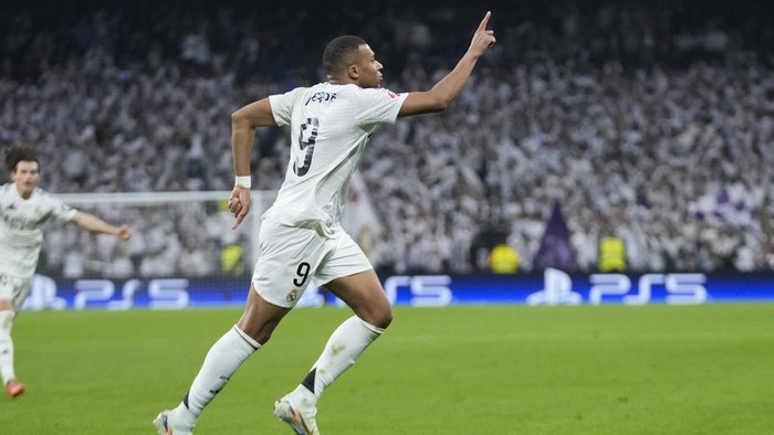 Kylian Mbappe Real Madrids Kylian Mbappe celebrates after scoring his sides second goal during the Spanish La Liga soccer match between Real Madrid and Getafe at the Santiago Bernabeu Stadium in Madrid, Spain, Sunday, Dec. 1, 2024. (AP Photo/Bernat Armangue)