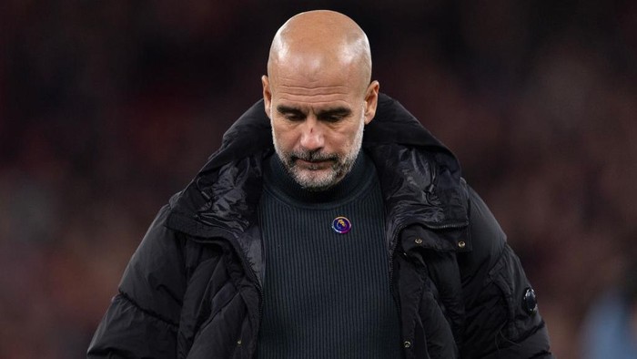 LIVERPOOL, ENGLAND - DECEMBER 1: Manchester City manager Pep Guardiola acknowledges the fans after the Premier League match between Liverpool FC and Manchester City FC at Anfield on December 1, 2024 in Liverpool, England. (Photo by Visionhaus/Getty Images)