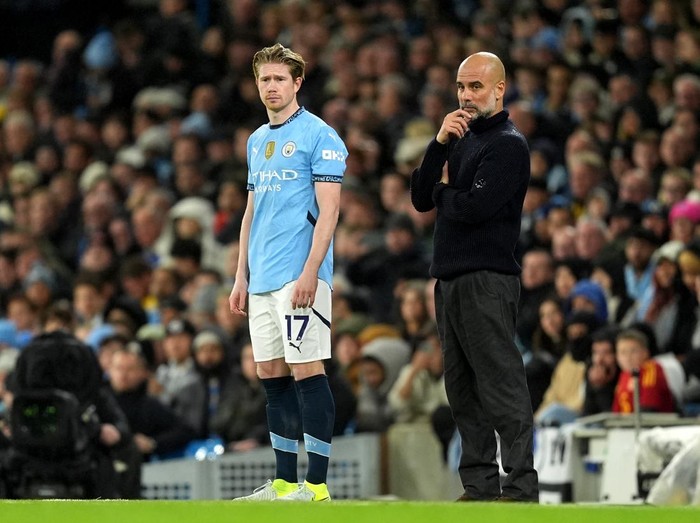 Manchester City substitute Kevin De Bruyne alongside manager Pep Guardiola during the Premier League match at the Etihad Stadium, Manchester. Picture date: Saturday November 23, 2024. (Photo by Martin Rickett/PA Images via Getty Images)