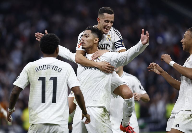Soccer Football - LaLiga - Real Madrid v Getafe - Santiago Bernabeu, Madrid, Spain - December 1, 2024 Real Madrid's Jude Bellingham celebrates scoring their first goal with Lucas Vazquez REUTERS/Juan Medina