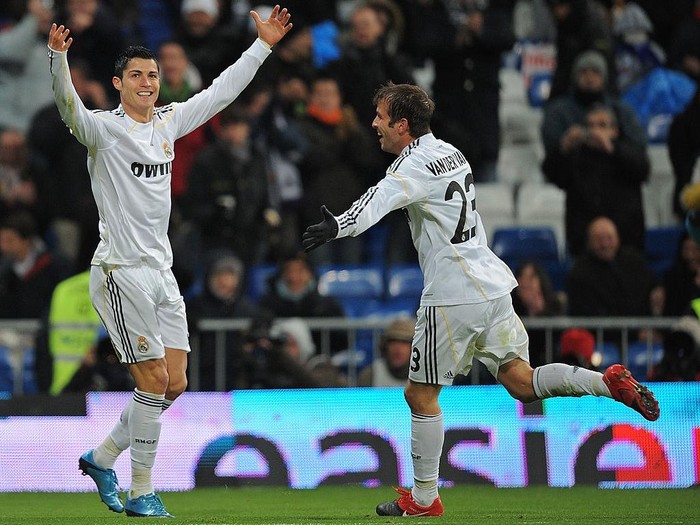 MADRID, SPAIN - DECEMBER 19:  Cristiano Ronaldo (L) of Real Madrid celebrates with fellow goalscorer Rafael Van Der Vaart after scoring the 5:0 goal during the La Liga match between Real Madrid and Real Zaragoza at the Santiago Bernabeu stadium on December 19, 2009 in Madrid, Spain.  (Photo by Denis Doyle/Getty Images)