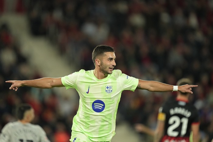 Barcelona's Ferran Torres celebrates after scoring the opening goal during a Spanish La Liga soccer match between Mallorca and Barcelona at the Son Moix stadium in Palma de Mallorca, Spain, Tuesday, Dec. 3, 2024. (AP Photo/Jose Breton)