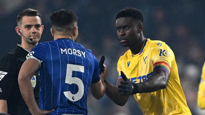 IPSWICH, ENGLAND - DECEMBER 03: Marc Guehi of Crystal Palace, wearing his rainbow coloured captains armband which reads 