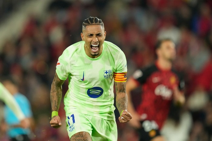 Raphinha right winger of Barcelona and Brazil celebrates after scoring his sides first  goal during the La Liga match between RCD Mallorca and FC Barcelona at Estadi de Son Moix on December 3, 2024 in Mallorca, Spain.  (Photo by Jose Breton/Pics Action/NurPhoto via Getty Images)