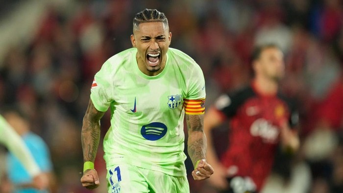 Raphinha right winger of Barcelona and Brazil celebrates after scoring his sides first  goal during the La Liga match between RCD Mallorca and FC Barcelona at Estadi de Son Moix on December 3, 2024 in Mallorca, Spain.  (Photo by Jose Breton/Pics Action/NurPhoto via Getty Images)