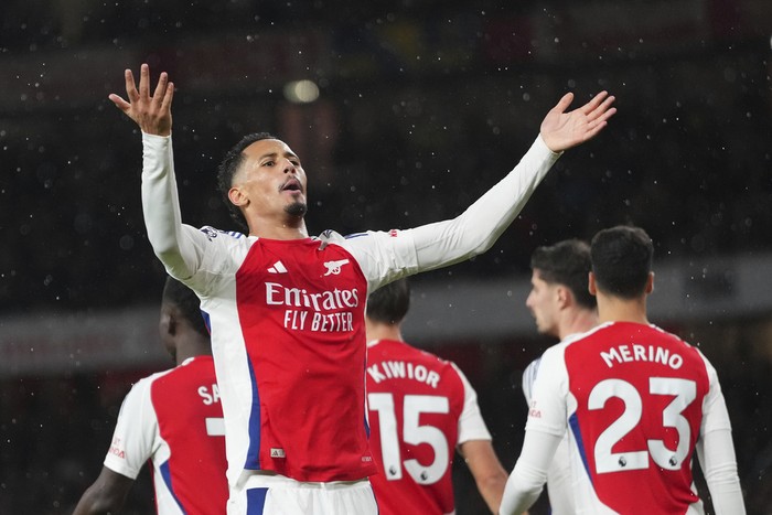 Arsenal, William Saliba Arsenal's William Saliba celebrates after scoring his side's second goal during the English Premier League soccer match between Arsenal and Manchester United at Emirates stadium in London, Wednesday, Dec. 4, 2024. (AP Photo/Kirsty Wigglesworth)