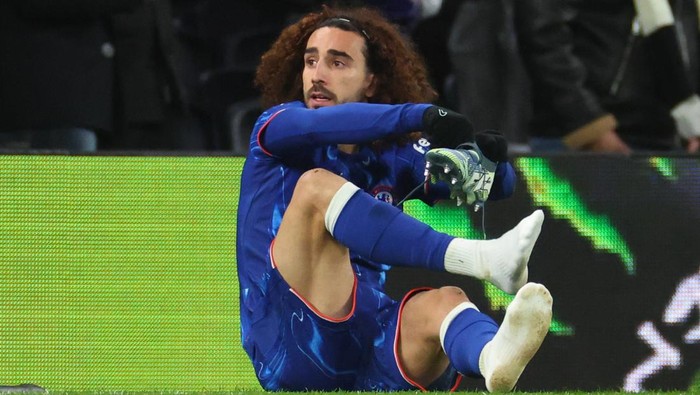 LONDON, ENGLAND - DECEMBER 08: Marc Cucurella of Chelsea changes his boots on the touchline early in the first half during the Premier League match between Tottenham Hotspur FC and Chelsea FC at Tottenham Hotspur Stadium on December 08, 2024 in London, England. (Photo by Marc Atkins/Getty Images)