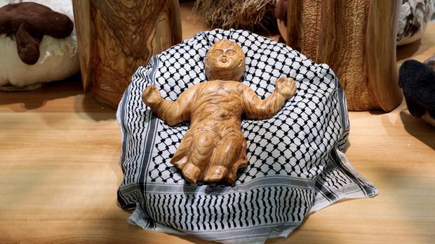 A view shows a baby Jesus figurine, that is part of a Nativity scene designed by artists and artisans from Bethlehem, in the Israeli-occupied West Bank, at the Paul VI hall at the Vatican, December 7, 2024. REUTERS/Remo Casilli