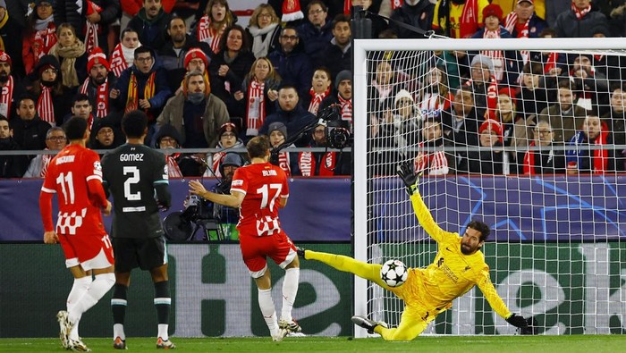 Soccer Football - Champions League - Girona v Liverpool - Estadi Montilivi, Girona, Spain - December 10, 2024 Liverpools Alisson Becker in action as he makes a save REUTERS/Albert Gea