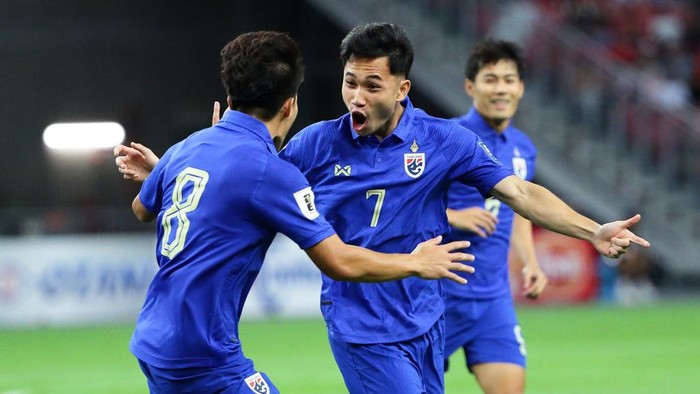 Supachok Sarachat of Thailand (R) reacts after scoring a goal during the FIFA World Cup Asian 2nd qualifier match between Singapore and Thailand at National Stadium on November 21, 2023 in Singapore.
 (Photo by Suhaimi Abdullah/NurPhoto via Getty Images)