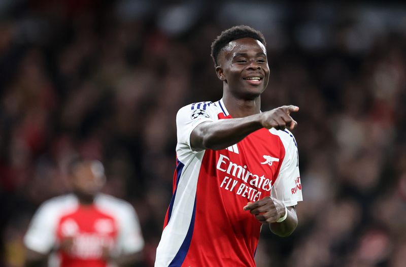 LONDON, ENGLAND - DECEMBER 11: Bukayo Saka of Arsenal celebrates after scoring a goal to make it 1-0 during the UEFA Champions League 2024/25 League Phase MD6 match between Arsenal FC and AS Monaco at Emirates Stadium on December 11, 2024 in London, England. (Photo by Catherine Ivill - AMA/Getty Images)