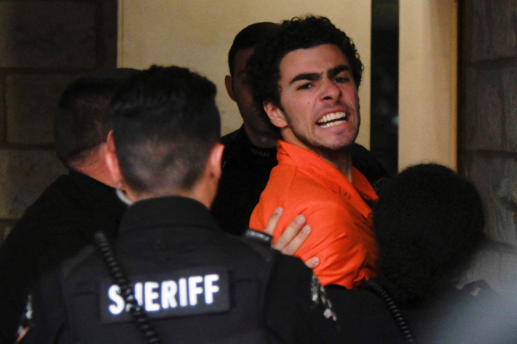 Luigi Mangione, 26, a suspect in the New York City killing of UnitedHealth executive Brian Thompson, arrives for an extradition hearing at Blair County Court House in Hollidaysburg, Pennsylvania, U.S. December 10, 2024.  REUTERS/Matthew Hatcher     TPX IMAGES OF THE DAY