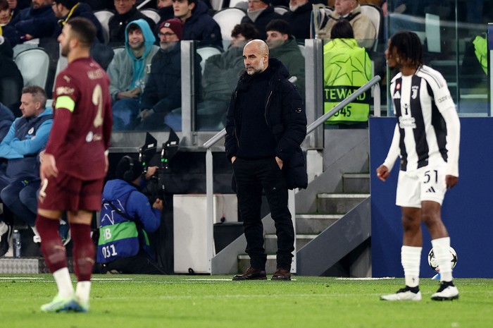Soccer Football - Champions League - Juventus v Manchester City - Allianz Stadium, Turin, Italy - December 11, 2024 Manchester City manager Pep Guardiola looks on REUTERS/Guglielmo Mangiapane