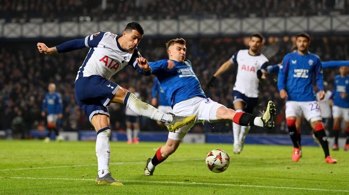 GLASGOW, SCOTLAND - DECEMBER 12: Pedro Porro of Tottenham Hotspur shoots during the UEFA Europa League 2024/25 League Phase MD6 match between Rangers FC and Tottenham Hotspur at Ibrox Stadium on December 12, 2024 in Glasgow, Scotland. (Photo by Stu Forster/Getty Images)