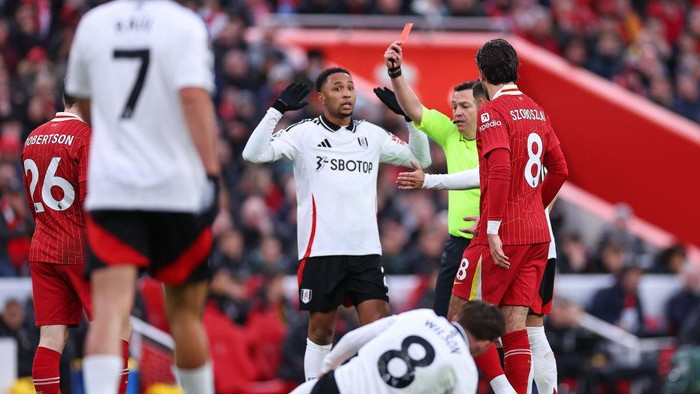 LIVERPOOL, ENGLAND - DECEMBER 14: Andrew Robertson of Liverpool is sent off during the Premier League match between Liverpool FC and Fulham FC at Anfield on December 14, 2024 in Liverpool, England. (Photo by Robbie Jay Barratt - AMA/Getty Images)