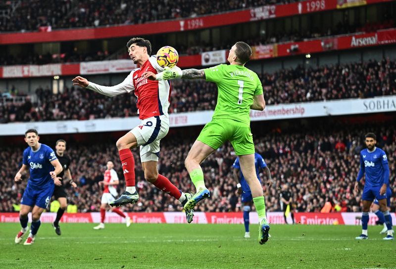 Soccer Football - Premier League - Arsenal v Everton - Emirates Stadium, London, Britain - December 14, 2024 Arsenal's Gabriel Jesus and Jurrien Timber after the match REUTERS/Dylan Martinez EDITORIAL USE ONLY. NO USE WITH UNAUTHORIZED AUDIO, VIDEO, DATA, FIXTURE LISTS, CLUB/LEAGUE LOGOS OR 'LIVE' SERVICES. ONLINE IN-MATCH USE LIMITED TO 120 IMAGES, NO VIDEO EMULATION. NO USE IN BETTING, GAMES OR SINGLE CLUB/LEAGUE/PLAYER PUBLICATIONS. PLEASE CONTACT YOUR ACCOUNT REPRESENTATIVE FOR FURTHER DETAILS..
