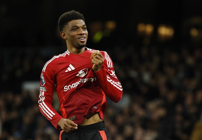 Amad Diallo Soccer Football - Premier League - Manchester City v Manchester United - Etihad Stadium, Manchester, Britain - December 15, 2024 Manchester United's Amad Diallo celebrates scoring their second goal Action Images via Reuters/Jason Cairnduff EDITORIAL USE ONLY. NO USE WITH UNAUTHORIZED AUDIO, VIDEO, DATA, FIXTURE LISTS, CLUB/LEAGUE LOGOS OR 'LIVE' SERVICES. ONLINE IN-MATCH USE LIMITED TO 120 IMAGES, NO VIDEO EMULATION. NO USE IN BETTING, GAMES OR SINGLE CLUB/LEAGUE/PLAYER PUBLICATIONS. PLEASE CONTACT YOUR ACCOUNT REPRESENTATIVE FOR FURTHER DETAILS..