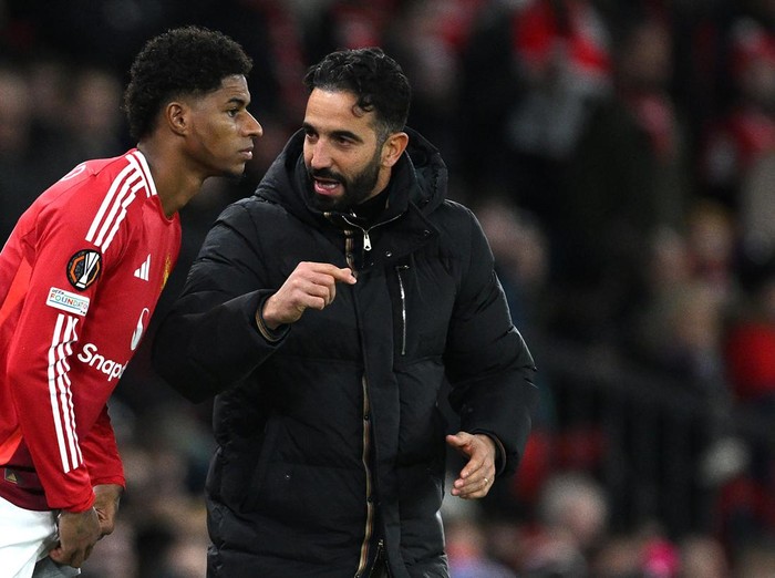 MANCHESTER, ENGLAND - NOVEMBER 28: Ruben Amorim, Head Coach of Manchester United, speaks to Marcus Rashford of Manchester United as he prepares to enter the pitch as a substitute during the UEFA Europa League 2024/25 League Phase MD5 match between Manchester United and FK Bodo/Glimt at Old Trafford on November 28, 2024 in Manchester, England. (Photo by Justin Setterfield/Getty Images)