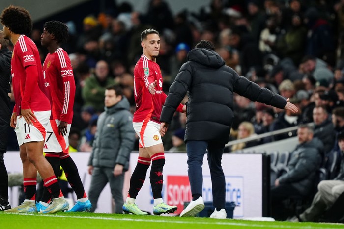 Manchester Uniteds Antony is embraced by manager Ruben Amorim (right) on the touchline during the Carabao Cup quarter-final match at the Tottenham Hotspur Stadium, London. Picture date: Thursday December 19, 2024. (Photo by Mike Egerton/PA Images via Getty Images)