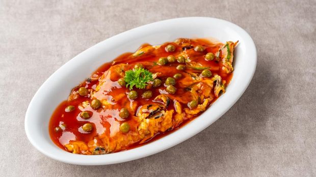 Fu yung hai, Puyonghai or egg foo young, a famous Chinese-style emelette dish in Indonesia. made from egg, vegetables and sauce