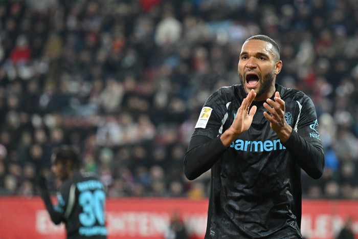 Jonathan Tah  Jonathan Tah of Bayer 04 Leverkusen reacts during the Bundesliga match between FC Augsburg and Bayer 04 Leverkusen at WWK-Arena on December 14, 2024 in Augsburg, Germany. (Photo by Sebastian Widmann/Getty Images)