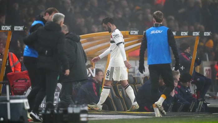Manchester Uniteds Bruno Fernandes (centre) heads down the tunnel after being sent off during the Premier League match at Molineux Stadium, Wolverhampton. Picture date: Thursday December 26, 2024. (Photo by David Davies/PA Images via Getty Images)
