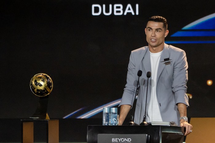 DUBAI, UNITED ARAB EMIRATES - DECEMBER 27: Cristiano Ronaldo of Al-Nassr gives a speech with his award during the Globe Soccer Dubai Awards 2024 as a part of the Dubai International Sports Conference 2024 in Dubai, United Arab Emirates (UAE) on December 27, 2024. (Photo by Waleed Zein/Anadolu via Getty Images)