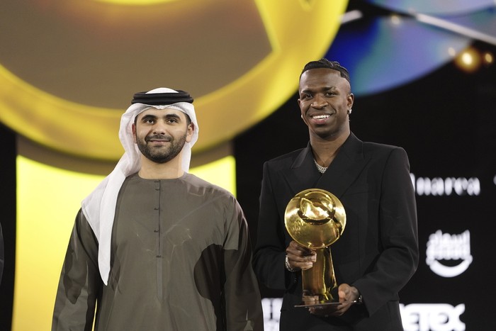 Real Madrids Vinicius Junior receives an award, during the Globe Soccer Awards 2025, in Dubai, UAE, Friday, Dec. 27, 2024. (Fabio Ferrari/LaPresse via AP)