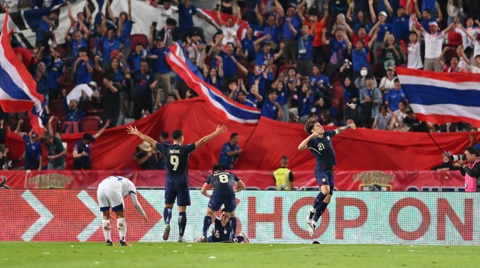 BANGKOK, THAILAND - DECEMBER 30: Peeradol Chamrasamee of Thailand (C) celebrates after scoring the teams first goal during the ASEAN Mitsubishi Electric Cup 2024 Semi Final second leg match between Thailand and Philippines at Rajamangala National Stadium on December 30, 2024 in Bangkok, Thailand. (Photo by Apinya Rittipo/Getty Images)