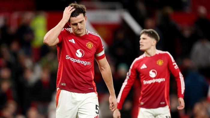 MANCHESTER, ENGLAND - DECEMBER 30: Harry Maguire of Manchester United appears dejected at the end of the Premier League match between Manchester United FC and Newcastle United FC at Old Trafford on December 30, 2024 in Manchester, England. (Photo by Carl Recine/Getty Images)