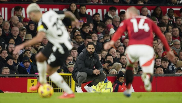 Manchester Uniteds head coach Ruben Amorim, center, reacts during the English Premier League soccer match between Manchester United and Newcastle at the Old Trafford stadium in Manchester, England, Monday, Dec. 30, 2024. (AP Photo/Dave Thompson)