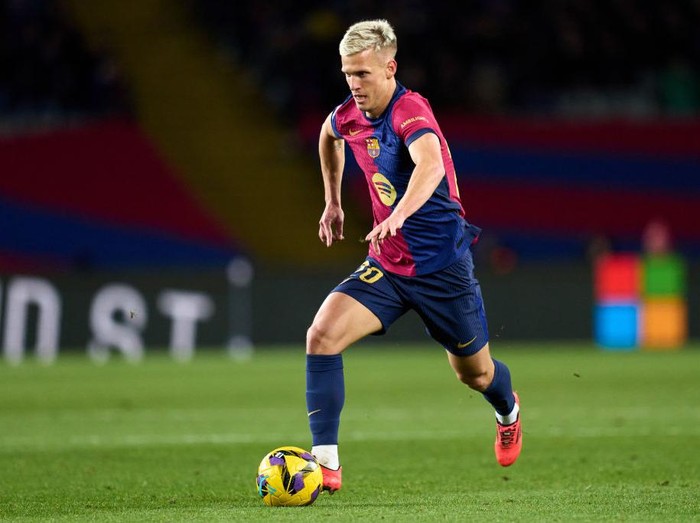 BARCELONA, SPAIN - DECEMBER 21: Dani Olmo of FC Barcelona runs with the ball during the LaLiga EASports match between FC Barcelona and Atletico de Madrid at Estadi Olimpic Lluis Companys on December 21, 2024 in Barcelona, Spain. (Photo by Alex Caparros/Getty Images)