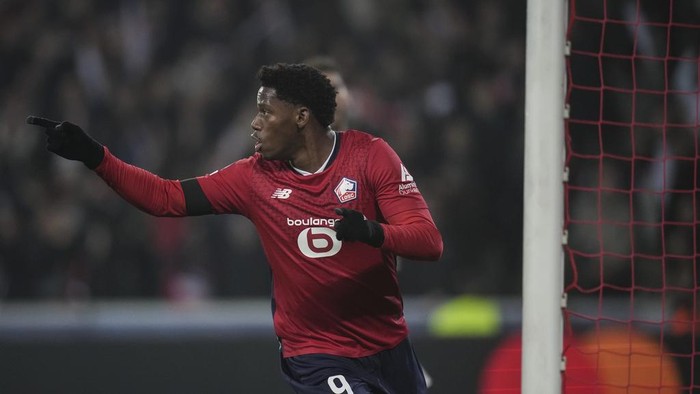 Lille's Jonathan David celebrates after scoring the opening goal during the Champions League opening phase soccer match between Lille and Juventus at the Stade Pierre Mauroy in Villeneuve-d'Ascq, outside Lille, France, Tuesday, Nov. 5, 2024. (AP Photo/Christophe Ena)