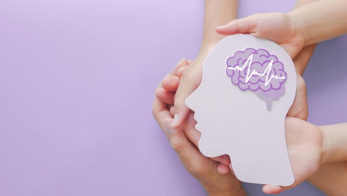 Ilustrasi otak Adult and child hands holding encephalography brain paper cutout,autism, Stroke, Epilepsy and alzheimer awareness, seizure disorder, stroke, ADHD, world mental health day concept