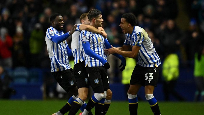 SHEFFIELD, ENGLAND - JANUARY 01: Josh Windass of Sheffield Wednesday celebrates with teammates after scoring his teams 2nd goal during the Sky Bet Championship match between Sheffield Wednesday FC and Derby County FC at Hillsborough on January 01, 2025 in Sheffield, England. (Photo by Gareth Copley/Getty Images)