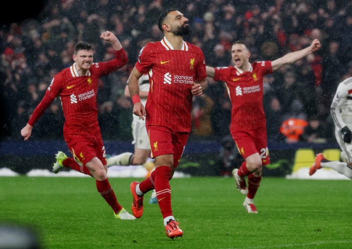 Soccer Football - Premier League - Liverpool v Manchester United - Anfield, Liverpool, Britain - January 5, 2025 Liverpools Mohamed Salah celebrates scoring their second goal REUTERS/Phil Noble EDITORIAL USE ONLY. NO USE WITH UNAUTHORIZED AUDIO, VIDEO, DATA, FIXTURE LISTS, CLUB/LEAGUE LOGOS OR LIVE SERVICES. ONLINE IN-MATCH USE LIMITED TO 120 IMAGES, NO VIDEO EMULATION. NO USE IN BETTING, GAMES OR SINGLE CLUB/LEAGUE/PLAYER PUBLICATIONS. PLEASE CONTACT YOUR ACCOUNT REPRESENTATIVE FOR FURTHER DETAILS..