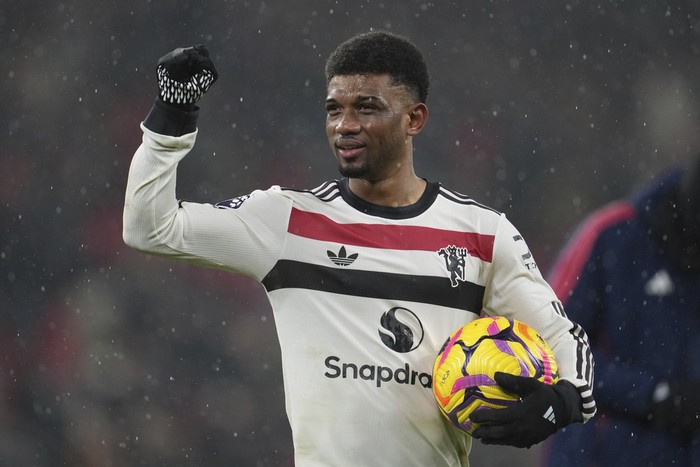 Manchester Uniteds Amad Diallo reacts at the end of the English Premier League soccer match against Liverpool at the Anfield stadium in Liverpool, England Sunday, Jan. 5, 2025. The match ended in a 2-2 draw. (AP Photo/Jon Super)