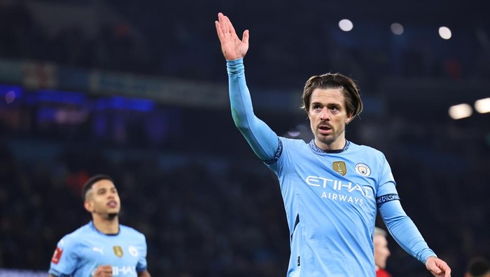 MANCHESTER, ENGLAND - JANUARY 11: Jack Grealish of Manchester City celebrates after scoring a goal to make it 4-0 during the Emirates FA Cup Third Round match between Manchester City and Salford City at Etihad Stadium on January 11, 2025 in Manchester, England. (Photo by Robbie Jay Barratt - AMA/Getty Images)