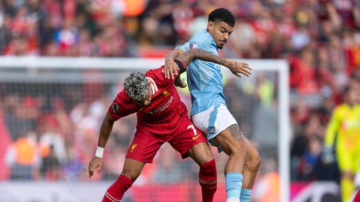 LIVERPOOL, ENGLAND - SEPTEMBER 14: Morgan Gibbs-White of Nottingham Forest and Luis Diaz of Liverpool in action during the Premier League match between Liverpool FC and Nottingham Forest FC at Anfield on September 14, 2024 in Liverpool, England. (Photo by Visionhaus/Getty Images)