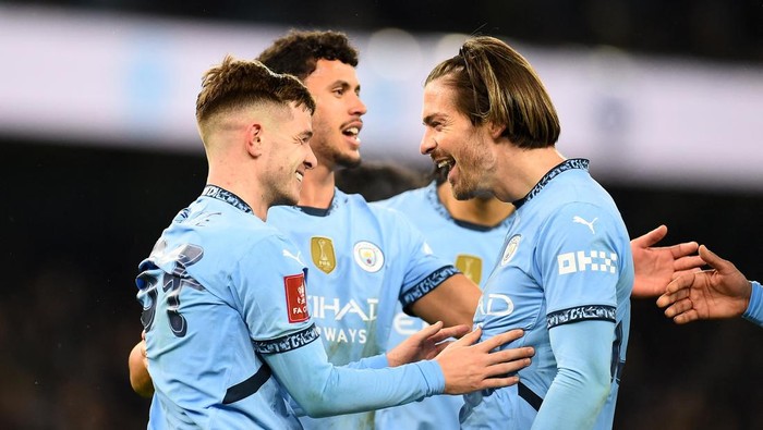 Soccer Football - FA Cup - Third Round - Manchester City v Salford City - Etihad Stadium, Manchester, Britain - January 11, 2025 Manchester Citys James McAtee celebrates scoring their eighth goal with Jack Grealish REUTERS/Peter Powell