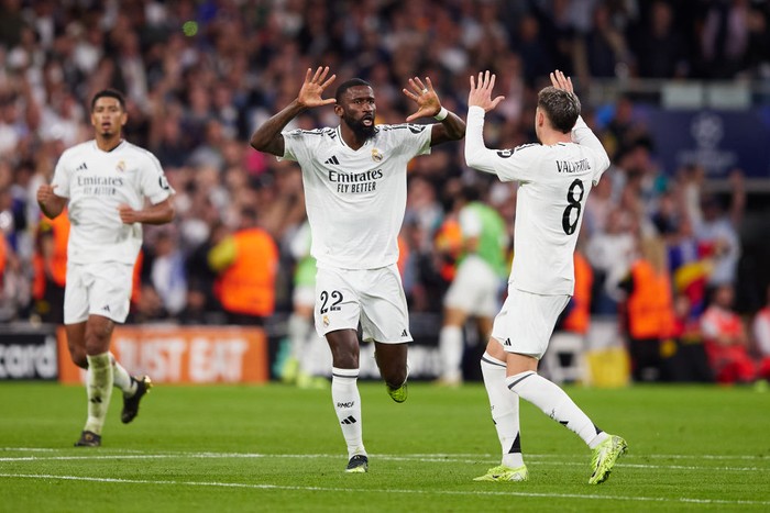 MADRID, SPAIN - OCTOBER 22: Antonio Rudiger of Real Madrid celebrates after scoring their sides first goal with his teammate Federico Valverde of Real Madrid during the UEFA Champions League 2024/25 League Phase MD3 match between Real Madrid C.F. and Borussia Dortmund at Estadio Santiago Bernabeu on October 22, 2024 in Madrid, Spain. (Photo by Alvaro Medranda/Quality Sport Images/Getty Images)