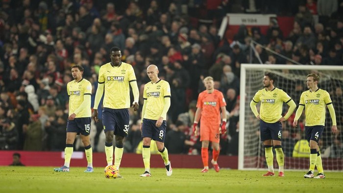 Southamptons tram players react after Manchester Uniteds Amad Diallo scored his sides second goal during the English Premier League soccer match between Manchester United and Southampton at the Old Trafford stadium in Manchester, England, Thursday, Jan. 16, 2025. (AP Photo/Dave Thompson)