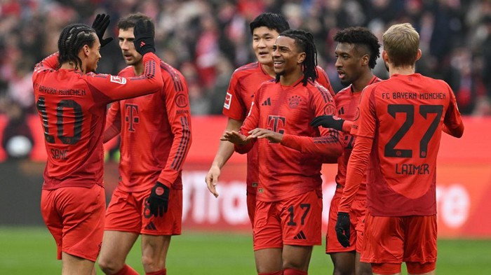 Bayern Munich Soccer Football - Bundesliga - Bayern Munich v VfL Wolfsburg - Allianz Arena, Munich, Germany - January 18, 2025 Bayern Munichs Michael Olise celebrates with Leroy Sane, Konrad Laimer, Kingsley Coman, Leon Goretzka and Kim Min-jae after scoring their second goal REUTERS/Angelika Warmuth DFL REGULATIONS PROHIBIT ANY USE OF PHOTOGRAPHS AS IMAGE SEQUENCES AND/OR QUASI-VIDEO.