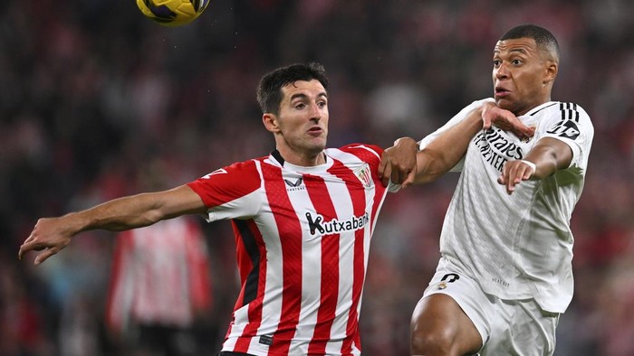 Daniel Vivian Athletic Bilbao's Daniel Vivian, left, challenges Real Madrid's Kylian Mbappe during the Spanish La Liga soccer match between Athletic Bilbao and Real Madrid at the San Mames stadium in Bilbao, Spain, Wednesday, Dec. 4, 2024. (AP Photo/Miguel Oses)