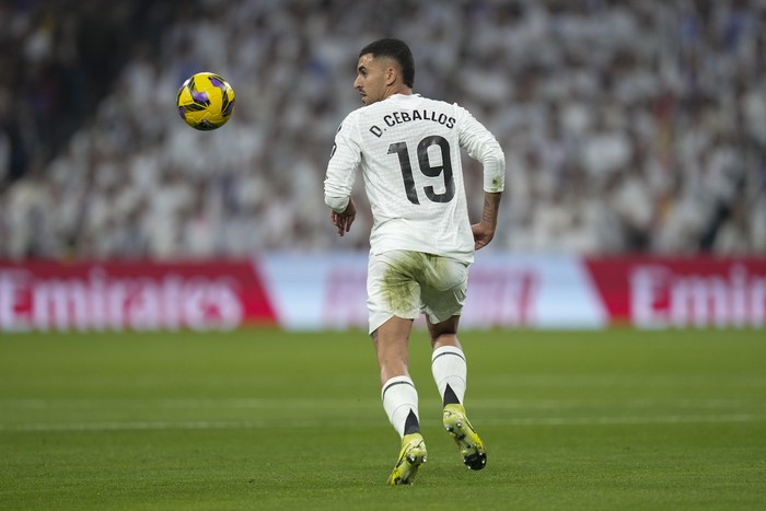 Real Madrids Dani Ceballos runs with the ball during the Spanish La Liga soccer match between Real Madrid and Getafe at the Santiago Bernabeu Stadium in Madrid, Spain, Sunday, Dec. 1, 2024. (AP Photo/Bernat Armangue)