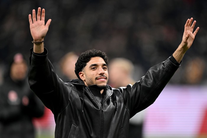 17 January 2025, Hesse, Frankfurt/Main: Soccer: Bundesliga, Eintracht Frankfurt - Borussia Dortmund, Matchday 18, Deutsche Bank Park. Frankfurt's Omar Marmoush says goodbye to the fans after the game. He is about to move to Manchester City. IMPORTANT NOTE: In accordance with the regulations of the DFL German Football League and the DFB German Football Association, it is prohibited to use or have used photographs taken in the stadium and/or of the match in the form of sequential images and/or video-like photo series. Photo: Arne Dedert/dpa (Photo by Arne Dedert/picture alliance via Getty Images)
