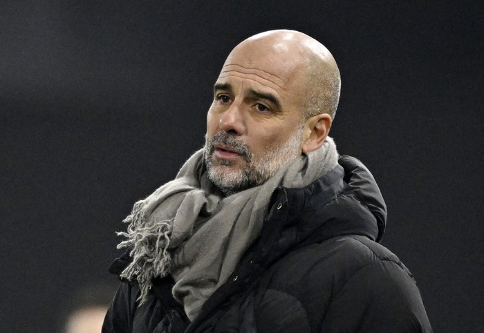 Soccer Football - Premier League - Ipswich Town v Manchester City - Portman Road, Ipswich, Britain - January 19, 2025  Manchester City manager Pep Guardiola reacts REUTERS/Tony O Brien EDITORIAL USE ONLY. NO USE WITH UNAUTHORIZED AUDIO, VIDEO, DATA, FIXTURE LISTS, CLUB/LEAGUE LOGOS OR LIVE SERVICES. ONLINE IN-MATCH USE LIMITED TO 120 IMAGES, NO VIDEO EMULATION. NO USE IN BETTING, GAMES OR SINGLE CLUB/LEAGUE/PLAYER PUBLICATIONS. PLEASE CONTACT YOUR ACCOUNT REPRESENTATIVE FOR FURTHER DETAILS..